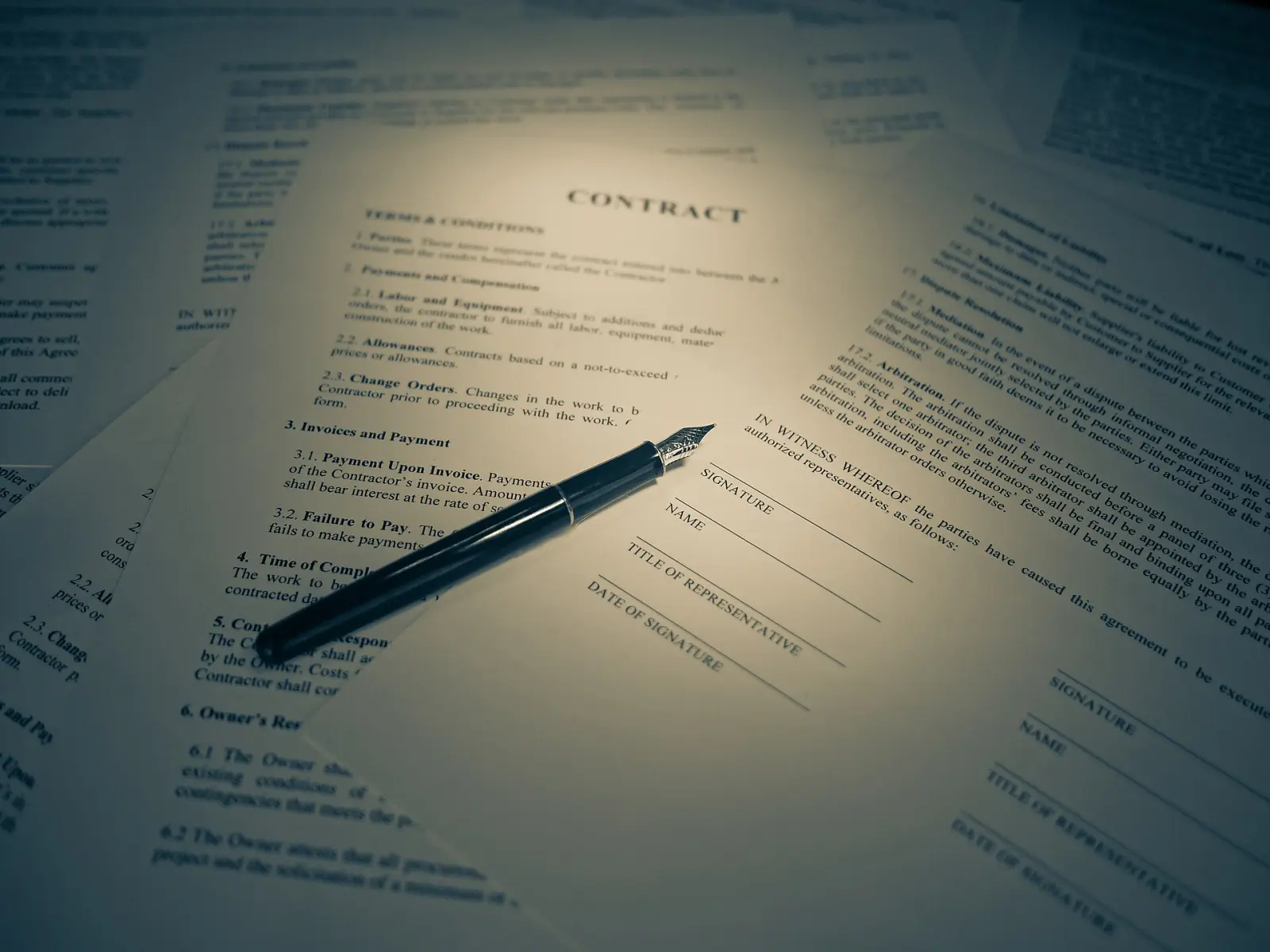 Contract and fountain pen on a desk